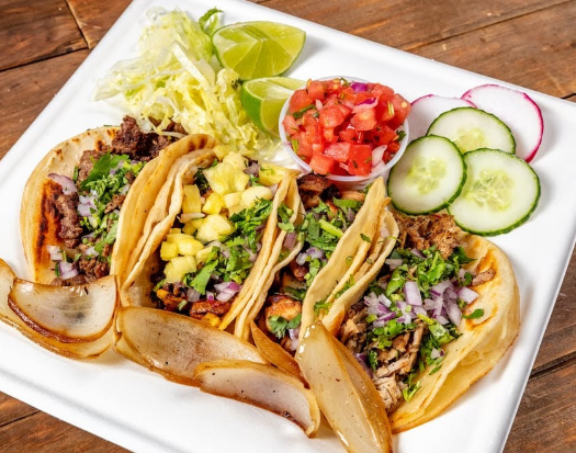 Street tacos with salsa, lime and cucumber